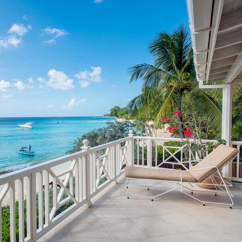 Take a seat on the balcony to enjoy views over the Caribbean Sea as the boats sail by