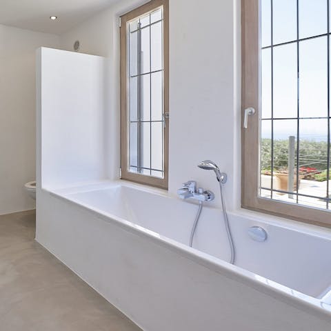 Treat yourself to an indulgent bath in one of the sleek bathrooms