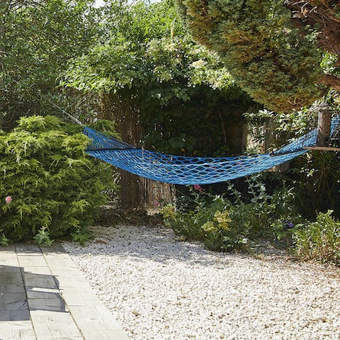 Lie back with a book on the hammock in the back garden