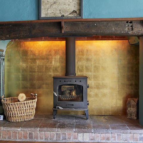 Gather around the wood-burning stove in the cosy sitting room