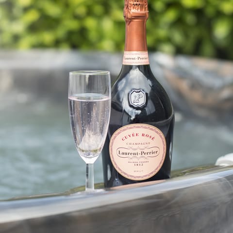 Toast to a happy holiday in your hot tub with a glass of complimentary Prosecco