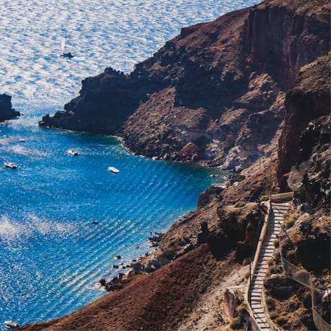 Hike across the mountainous terrain of Santorini