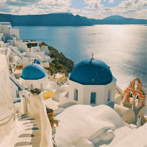 Soak in the stunning vistas of historic Oia