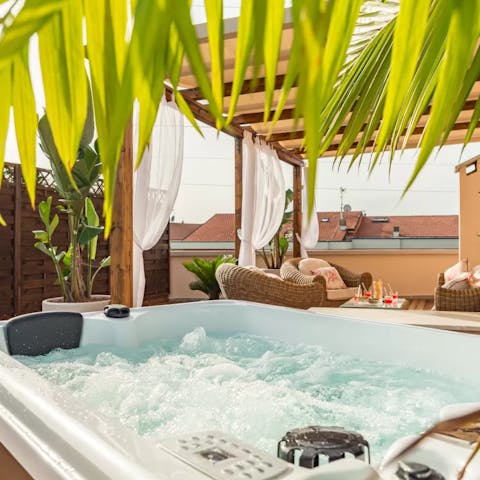Relax in the hot tub and soak up the sun