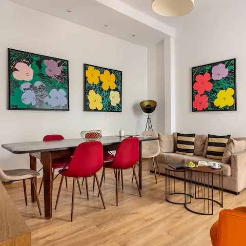 Admire the bold, floral artworks in the charming living room