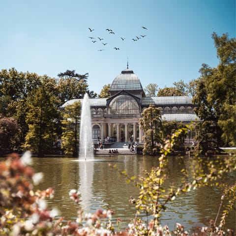 Take a sunny stroll through El Retiro Park, twenty-five minutes away by Metro