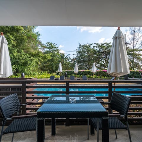 Settle down for Pad Thai or a Green Thai Curry at the balcony dining table