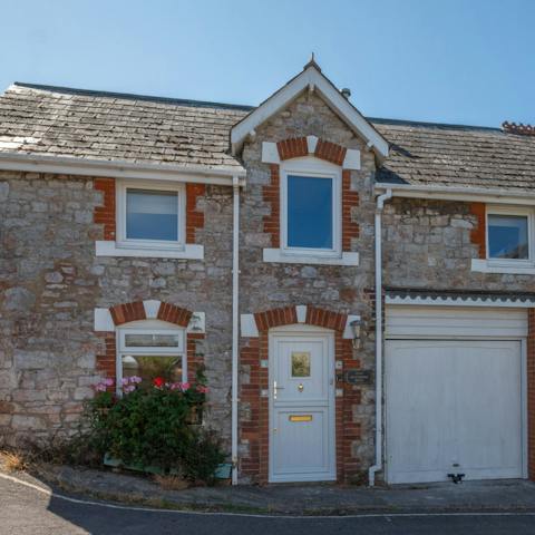 Admire the rustic stonework of your gorgeous home in a peaceful mews