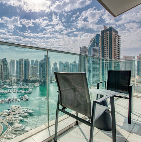 Sip on a nice glass of wine on your balcony, overlooking the iconic marina