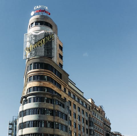 Embrace the buzz of city living with an atmospheric stroll along Gran Via – only three–minutes away
