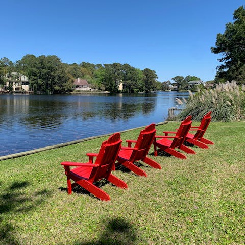 Watch the boats go by from the lagoon's edge