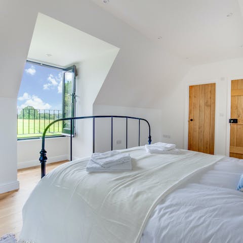 Open the bedroom's big window to let the outside in