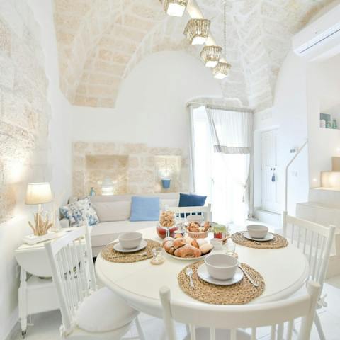 Start mornings with coffee and pastries in the stone walled living area
