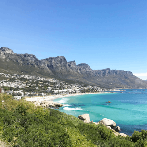 Relax on the white sands of Clifton 1st Beach, a short drive away