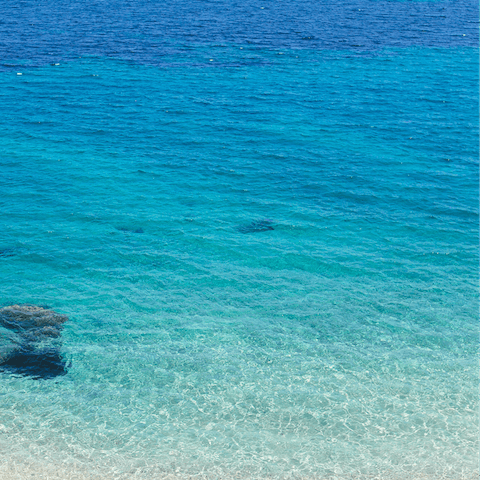 Swim the crystal clear waters off of Barbati Beach, just 100m from your apartment