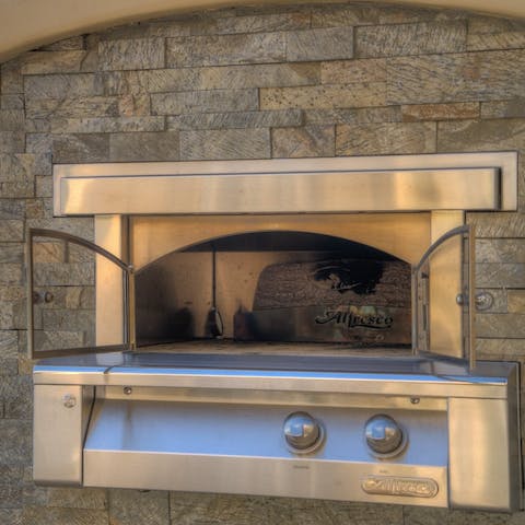 Bake delicious pizzas in the outdoor oven