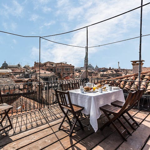 Admire breathtaking views over Venice from the private roof terrace