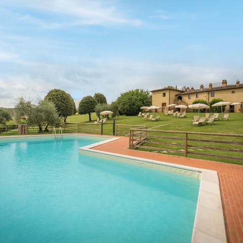 Soak up the Tuscan sun from in or beside the communal pool