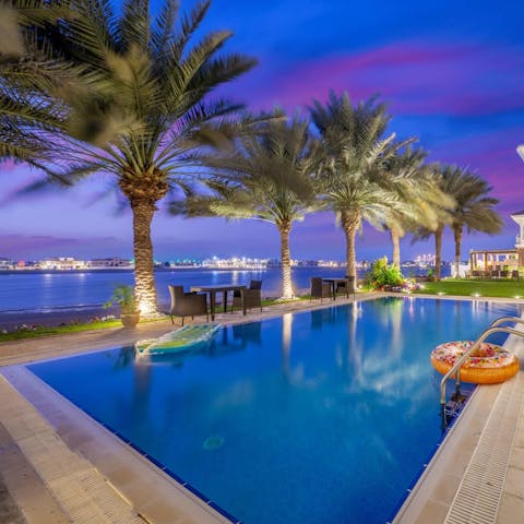 Lay by the poolside and take in Palm Jumeirah's sea views