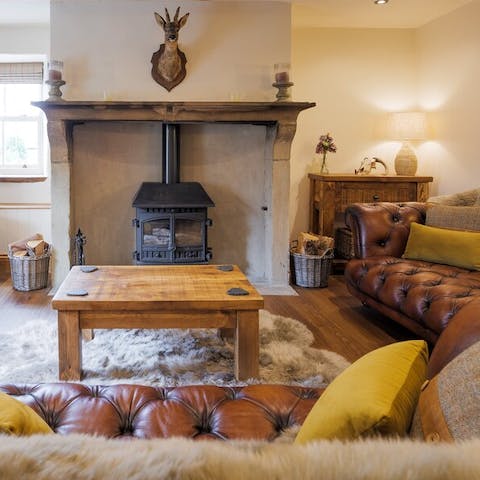 Curl up by the log burning stove for a cosy evening in 
