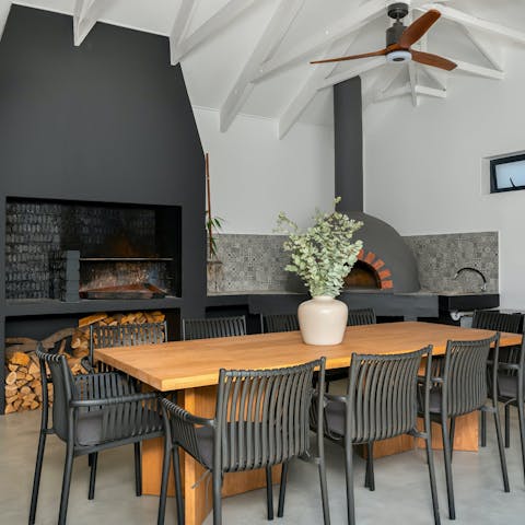 Fire up the pizza oven for dinner in the modern dining area