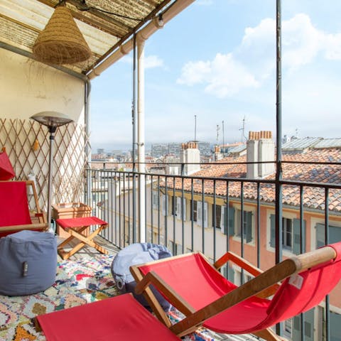 Look out over the rooftops as you sip your morning coffee out on the balcony