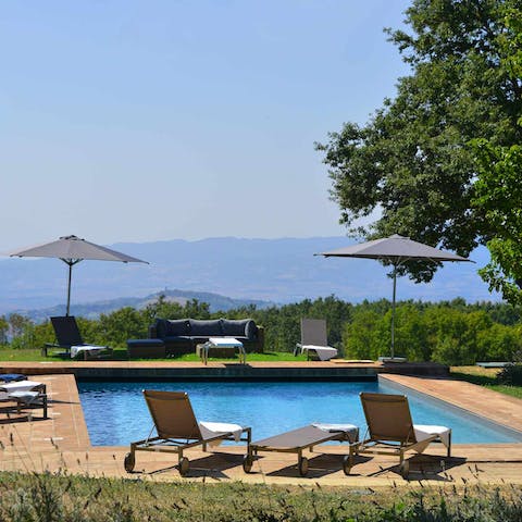 Relax and rejuvenate by the pool with incredible views of the Tuscan hillsides