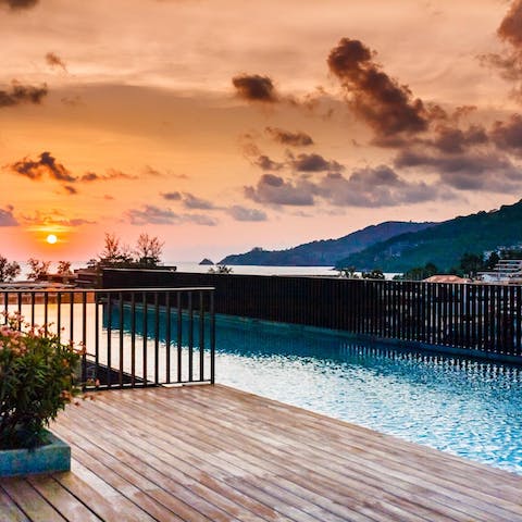 Make your way up to the rooftop pool to watch the sun set beyond the hills