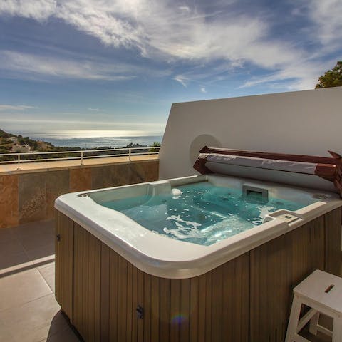 Sink into the private terrace's Jacuzzi amidst stunning views