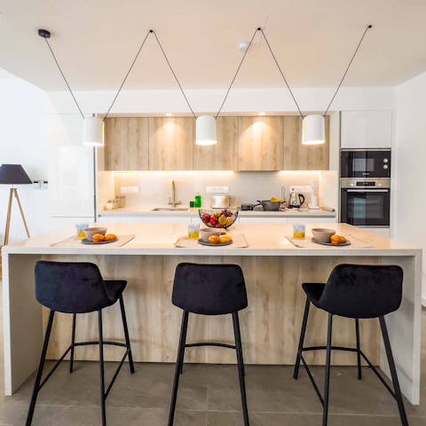 Rustle up a bite to eat in the sleek, modern kitchen