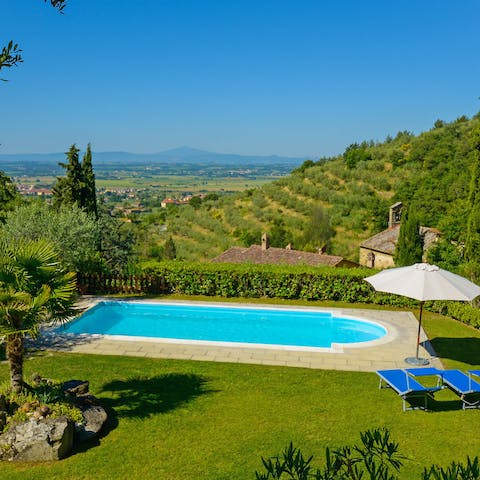 Admire beautiful views of the rolling Tuscan hills and beyond