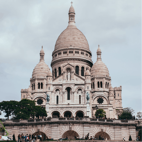 Gaze up at Montmartre's beautiful Sacré-Cœur Basilica, a fourteen-minute walk away
