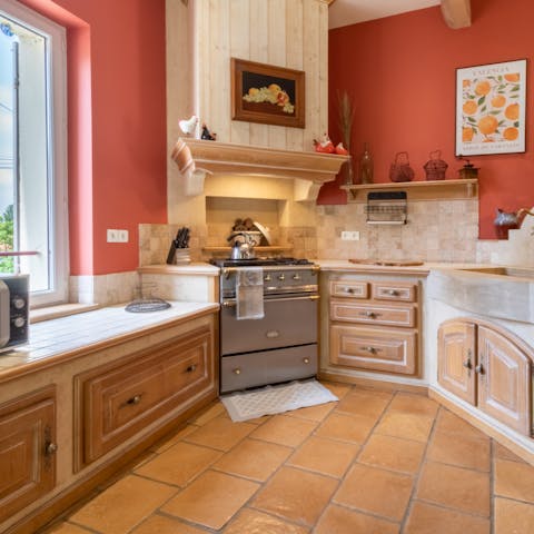 Cook some dinner in the beautifully decorated kitchen, with large windows overlooking the garden to let the sunlight in