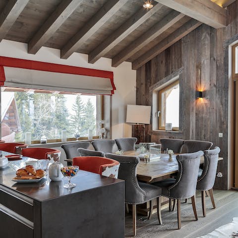 Dine with a view of the snow-tipped pines from the picture-frame window
