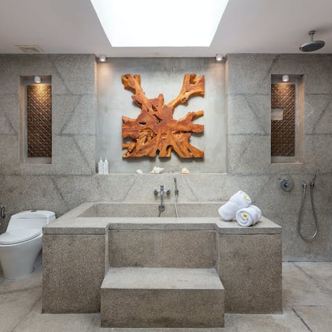 Wash off with a bath or shower in the imposing ensuite bathrooms