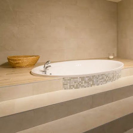 As well as this spa-style jacuzzi, the home also has a sauna
