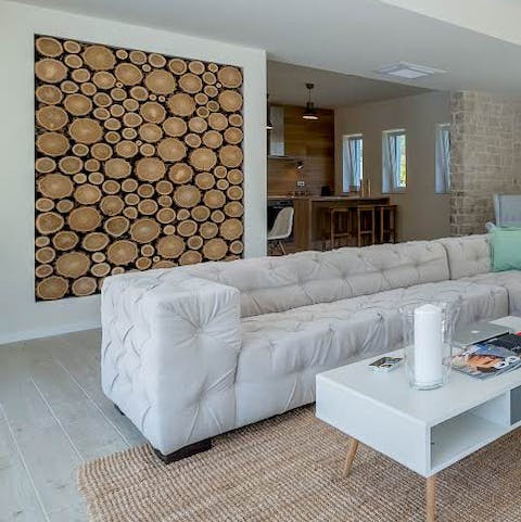 Unusual little touches like the log wall bring this home to life