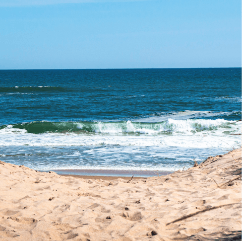 Soak your feet in the warm sand at Foster Memorial Beach