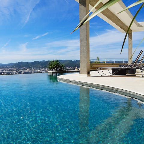 Watch over Ibiza Town from the edge of your infinity pool