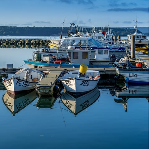 Take the ten-minute drive to Poole Quay to watch the boats come and go from a waterside pub