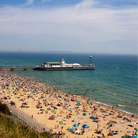 Pack a picnic and your seaside essentials and set out on the twenty-minute drive to Bournemouth Beach