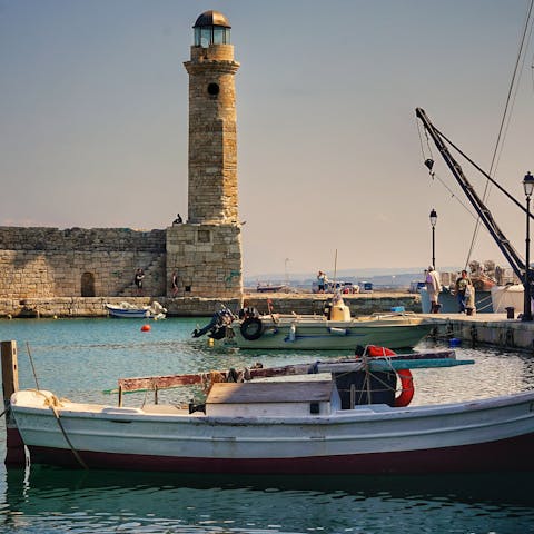 Enjoy a drink looking out over the 14th-century Venetian harbour in nearby Rethymno