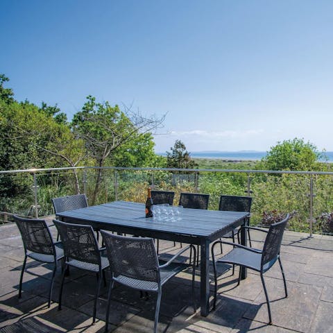 Take in the views of the Gower Peninsula with sundowners