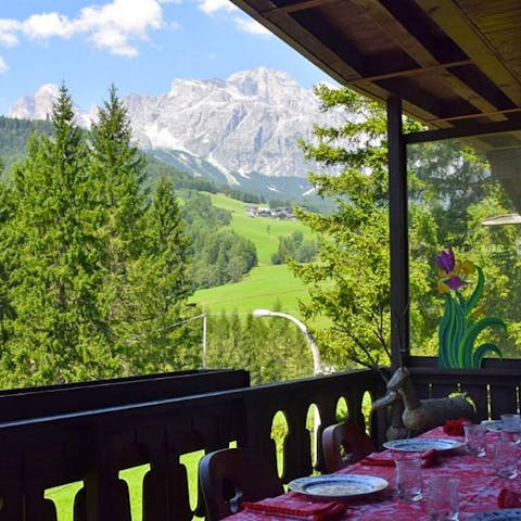 Have breakfast in the fresh air and admire this view of the Dolomites