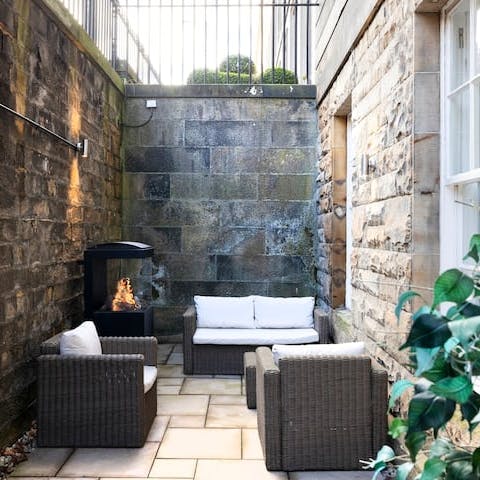 Relax with a wee dram next to the outdoor fireplace when the Scottish weather turns chilly