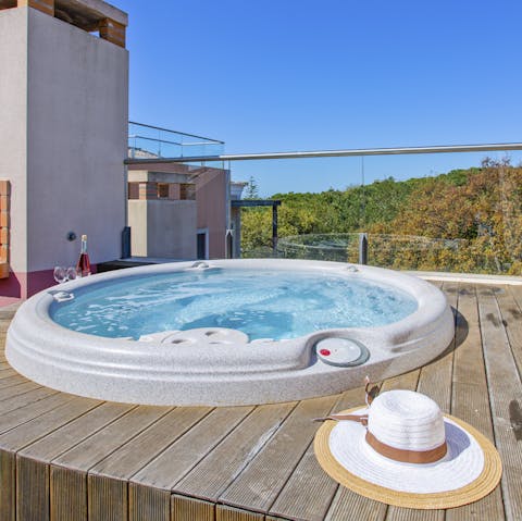 Take a chilled bottle of champagne out to the rooftop hot tub