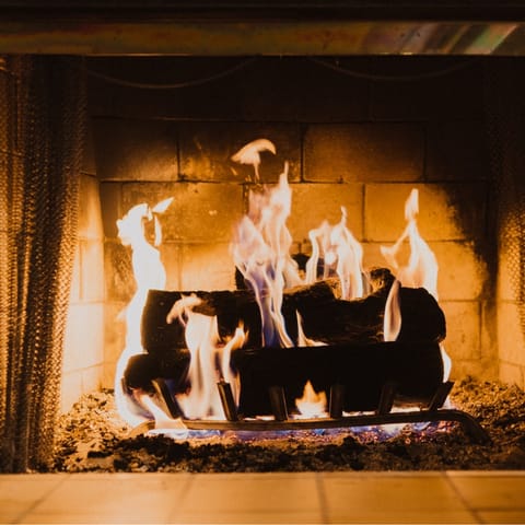 Spend evenings snuggled up next to the wood-burning fireplace