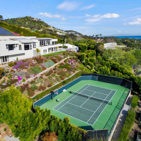 Spend time on the tennis court, surrounded by fruit orchards