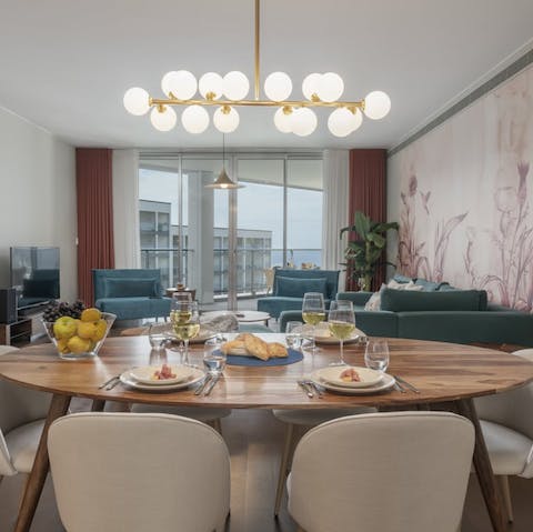 Prepare dinner in your well-equipped kitchen and tuck in around the chic dining table