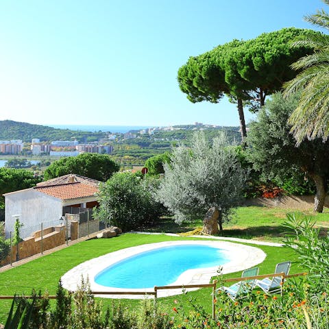 Take a dip in the garden pool under the palms